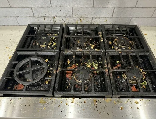 Gas stovetop before cleaning